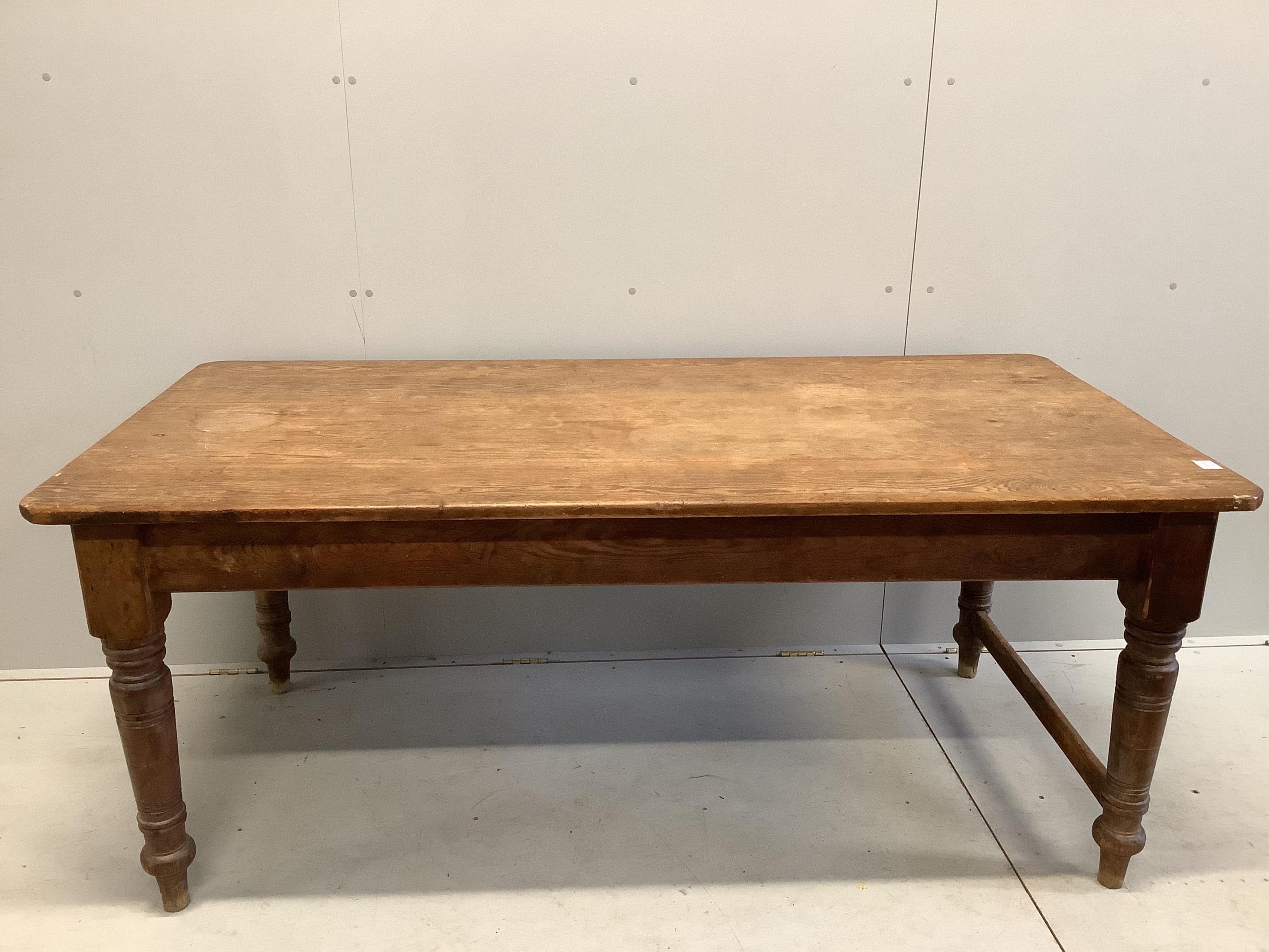 A Victorian rectangular pitch pine kitchen table, width 183cm, depth 90cm, height 75cm. Condition - fair